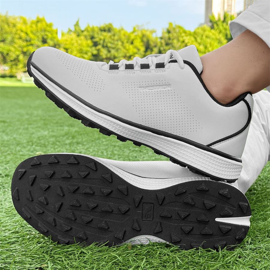 Women's Athletic Spikeless Golf Shoe on the golf course, view 1