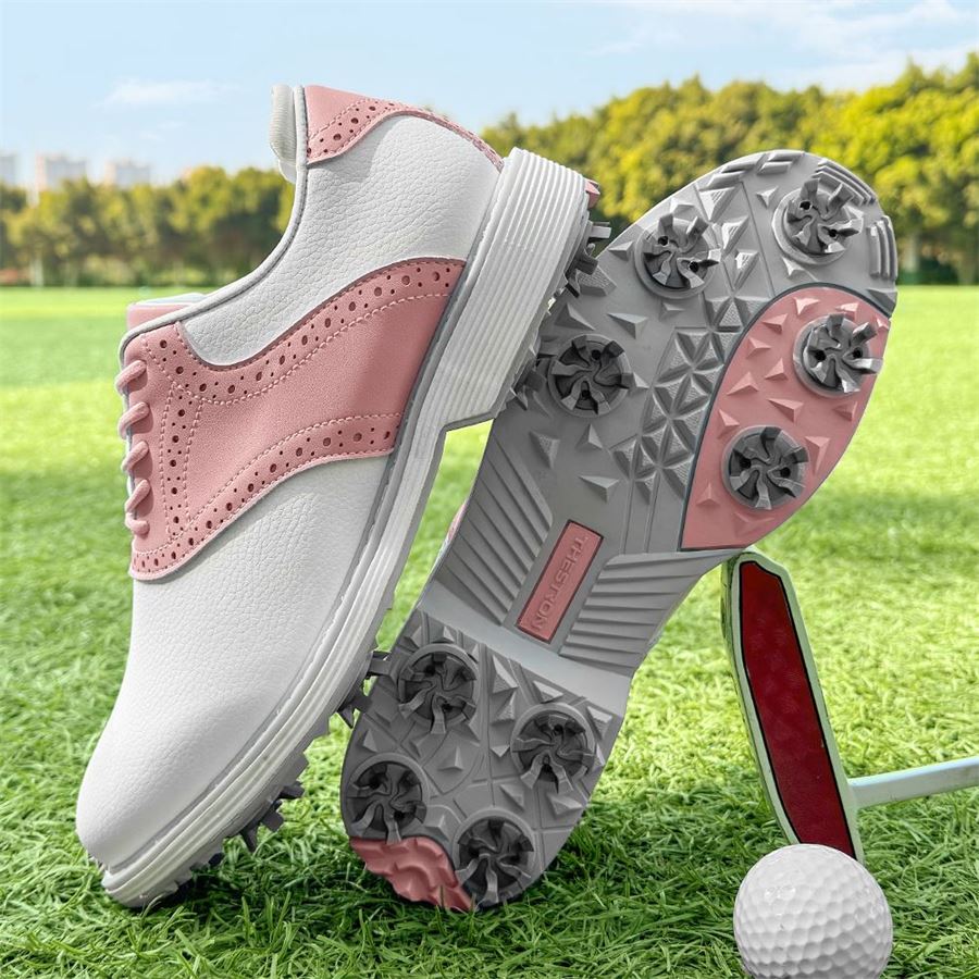Women's Saddle Spiked Golf Shoe on the golf course, view 2