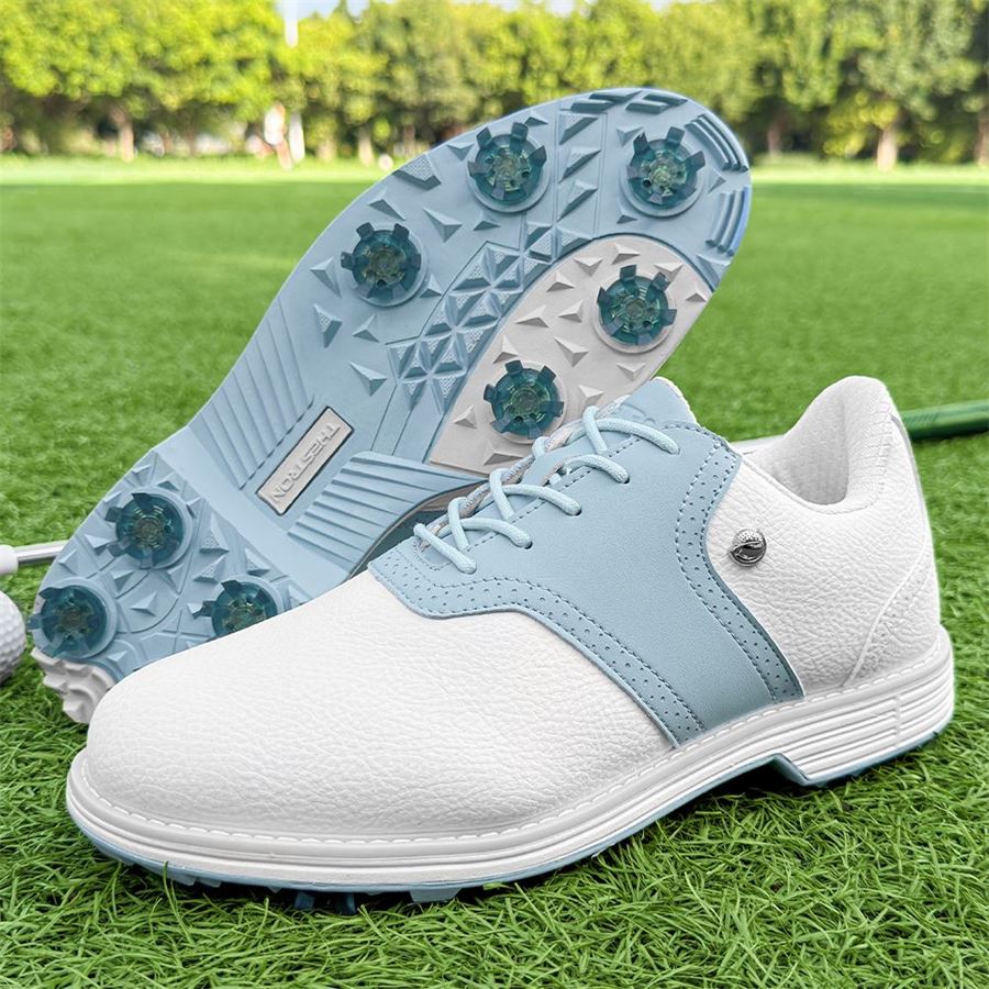 Women's Heritage Saddle Spiked Golf Shoe on the golf course, view 1