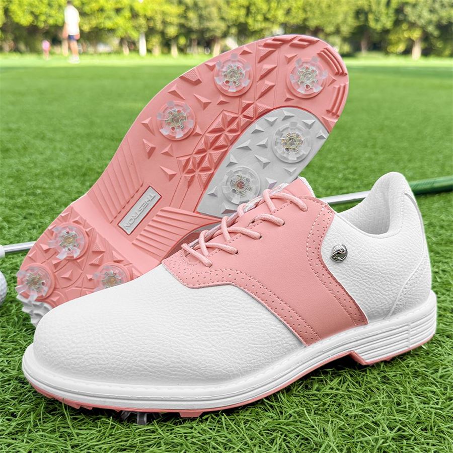 Women's Heritage Saddle Spiked Golf Shoe on the golf course, view 2