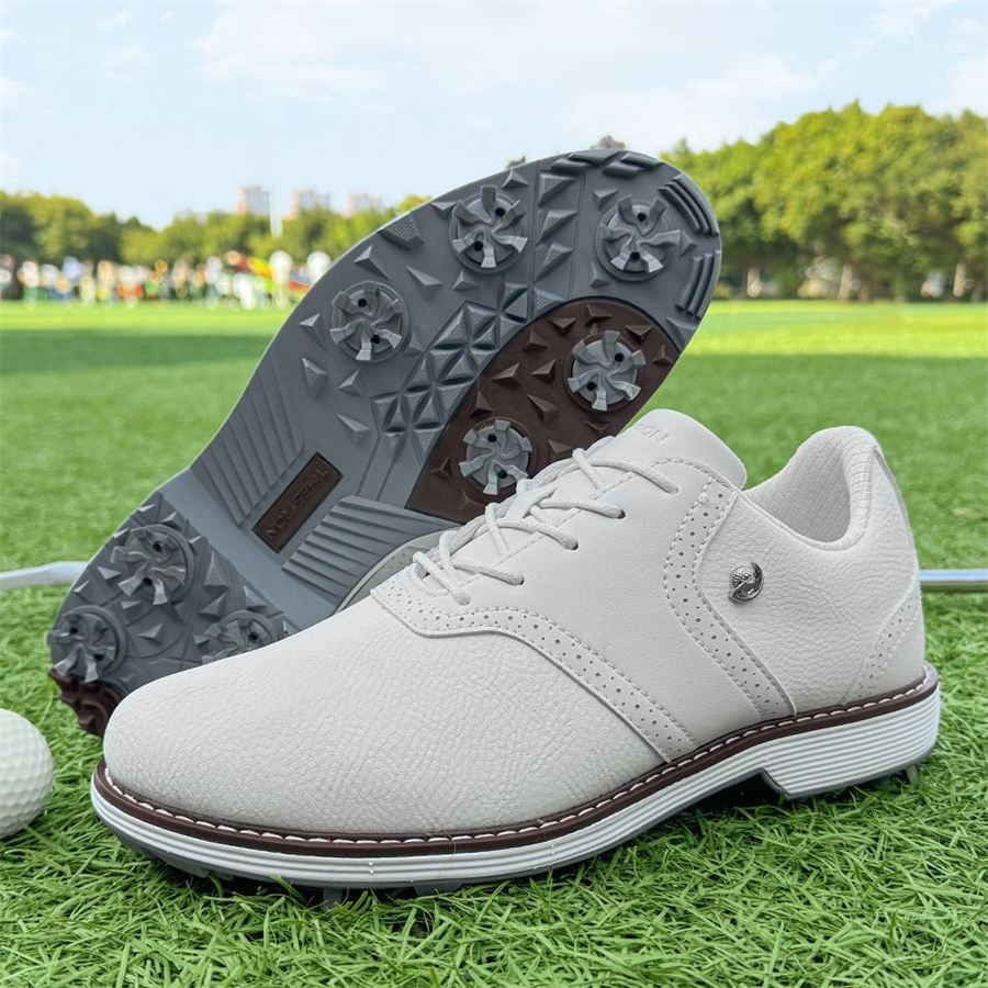 Heritage Saddle Spiked Golf Shoe on the golf course, view 1