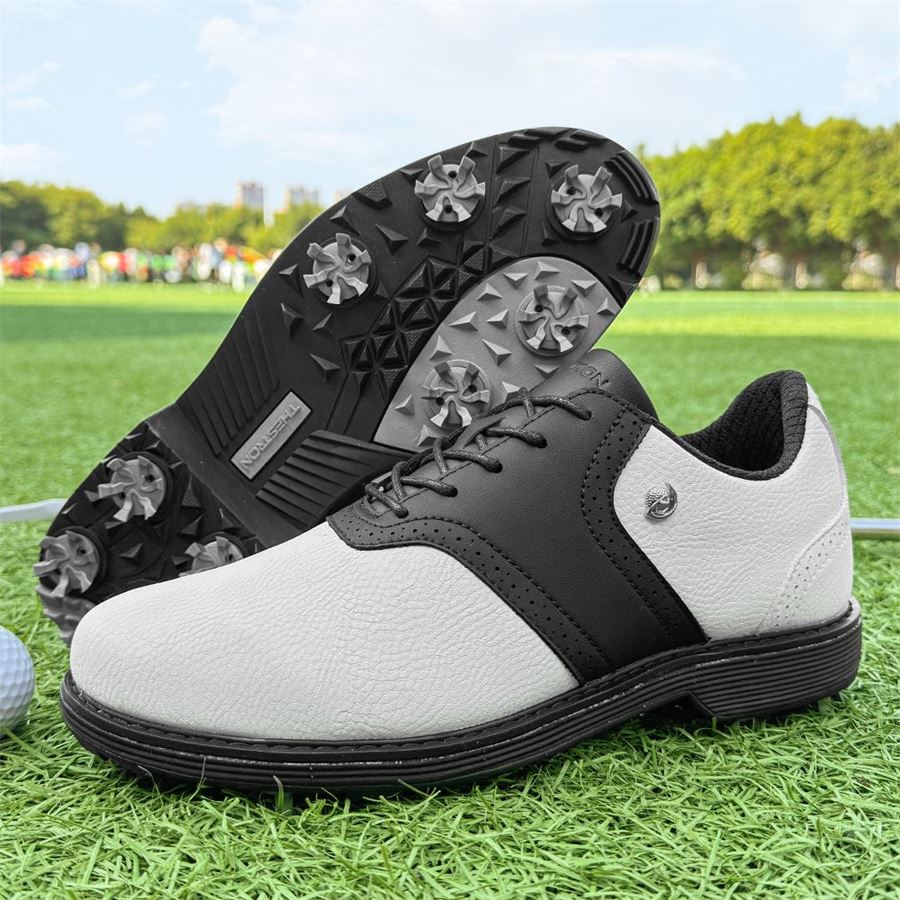 Heritage Saddle Spiked Golf Shoe on the golf course, view 3